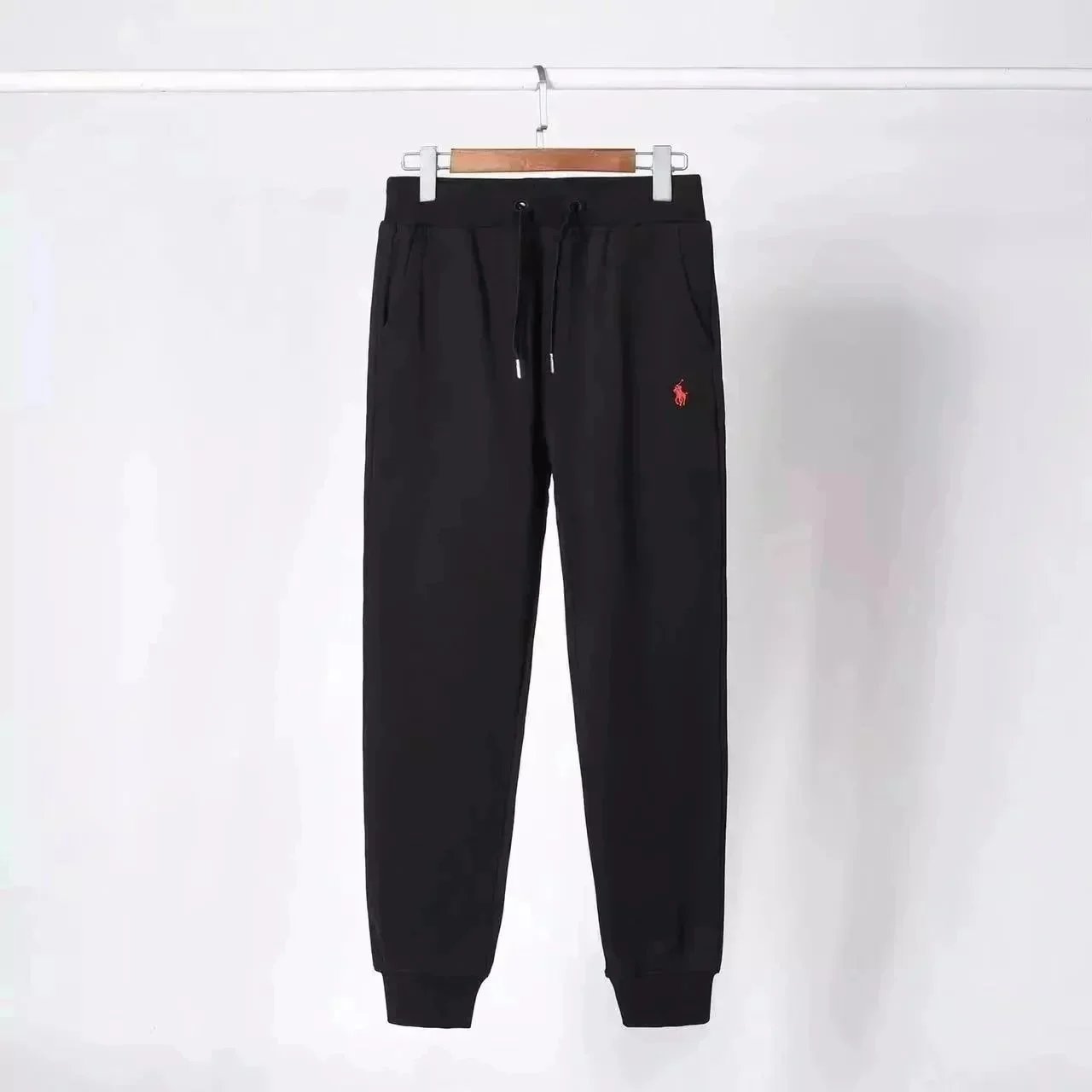 Black pants with a red label Black pants with a red label
